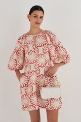 Profile view of model wearing the Oroton Liv Small Day Bag in Paper White and Pebble leather for Women