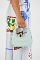 Profile view of model wearing the Oroton Clara Mini Bag in  and Pebble leather for Women