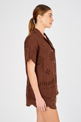 Profile view of model wearing the Oroton Broderie Camp Shirt in Espresso and 100% linen for Women
