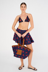Profile view of model wearing the Oroton Dutch Tulip Bikini Top in North Sea and 78% polyamide, 22% elastane for Women