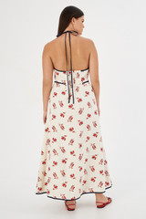 Profile view of model wearing the Oroton Dutch Tulip Halter Sundress in Ecru and 100% linen for Women