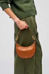 Profile view of model wearing the Oroton Florence Small Shoulder Bag in Cognac and Smooth leather for Women