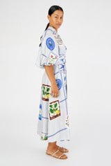 Profile view of model wearing the Oroton Picnic Print Dress in Pale Blue and 100% silk for Women