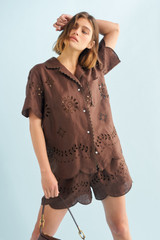 Profile view of model wearing the Oroton Broderie Camp Shirt in Espresso and 100% linen for Women