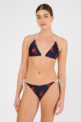 Profile view of model wearing the Oroton Dutch Tulip Bikini Bottom in North Sea and 78% polyamide, 22% elastane for Women