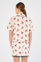 Profile view of model wearing the Oroton Crop Dutch Tulip Camp Shirt in Ecru and 100% linen for Women