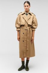 Profile view of model wearing the Oroton Trench in Dark Camel and 65% polyester, 35% cotton for Women