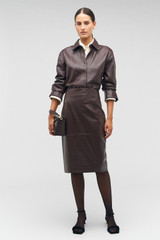 Profile view of model wearing the Oroton Embossed Croc Long Sleeve Overshirt in Burgundy and 100% leather for Women