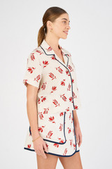 Profile view of model wearing the Oroton Crop Dutch Tulip Camp Shirt in Ecru and 100% linen for Women
