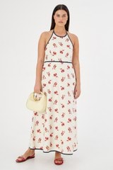 Profile view of model wearing the Oroton Dutch Tulip Halter Sundress in Ecru and 100% linen for Women