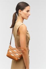 Profile view of model wearing the Oroton Leigh Ric Rac Crossbody in Amber and Smooth leather for Women