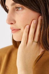 Profile view of model wearing the Oroton Fife Ring in 18K Gold and Sustainably sourced 925 Sterling Silver for Women