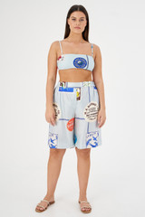 Profile view of model wearing the Oroton Picnic Print Short in Pale Blue and 100% silk for Women