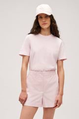 Profile view of model wearing the  Alfie Carpenter Short in Palest Pink and Crafted from cotton twill  for Men
