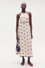 Profile view of model wearing the Oroton Dutch Tulip Halter Sundress in Ecru and 100% linen for Women