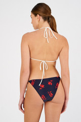 Profile view of model wearing the Oroton Dutch Tulip Bikini Bottom in North Sea and 78% polyamide, 22% elastane for Women