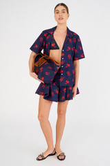 Profile view of model wearing the Oroton Dutch Tulip Skort in North Sea and 100% cotton for Women