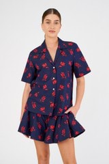 Profile view of model wearing the Oroton Dutch Tulip Print Camp Shirt in North Sea and 100% cotton for Women