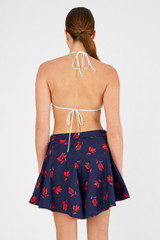 Profile view of model wearing the Oroton Dutch Tulip Skort in North Sea and 100% cotton for Women