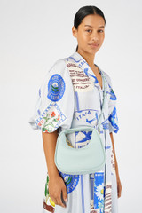 Profile view of model wearing the Oroton Clara Mini Bag in  and Pebble leather for Women