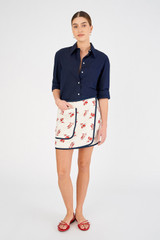 Profile view of model wearing the Oroton Dutch Tulip Wrap Skirt in Ecru and 100% linen for Women