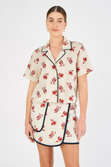 Profile view of model wearing the Oroton Crop Dutch Tulip Camp Shirt in Ecru and 100% linen for Women