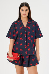 Profile view of model wearing the Oroton Dutch Tulip Print Camp Shirt in North Sea and 100% cotton for Women