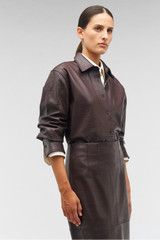 Profile view of model wearing the Oroton Embossed Croc Long Sleeve Overshirt in Burgundy and 100% leather for Women