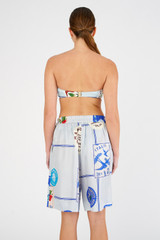Profile view of model wearing the Oroton Picnic Print Short in Pale Blue and 100% silk for Women
