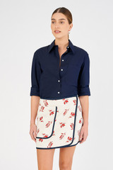 Profile view of model wearing the Oroton Dutch Tulip Wrap Skirt in Ecru and 100% linen for Women