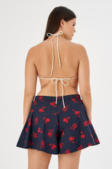 Profile view of model wearing the Oroton Dutch Tulip Bikini Top in North Sea and 78% polyamide, 22% elastane for Women