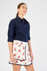 Profile view of model wearing the Oroton Dutch Tulip Wrap Skirt in Ecru and 100% linen for Women
