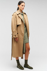 Profile view of model wearing the Oroton Trench in Dark Camel and 65% polyester, 35% cotton for Women