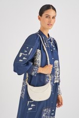 Profile view of model wearing the Oroton Florence Small Shoulder Bag in Clotted Cream and Smooth leather for Women