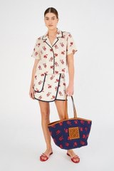 Profile view of model wearing the Oroton Crop Dutch Tulip Camp Shirt in Ecru and 100% linen for Women