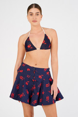 Profile view of model wearing the Oroton Dutch Tulip Bikini Top in North Sea and 78% polyamide, 22% elastane for Women