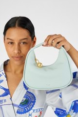 Profile view of model wearing the Oroton Clara Mini Bag in  and Pebble leather for Women