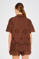 Profile view of model wearing the Oroton Broderie Camp Shirt in Espresso and 100% linen for Women