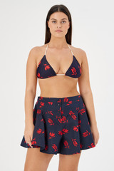 Profile view of model wearing the Oroton Dutch Tulip Bikini Top in North Sea and 78% polyamide, 22% elastane for Women
