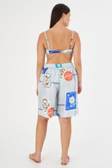 Profile view of model wearing the Oroton Picnic Print Short in Pale Blue and 100% silk for Women