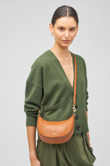 Profile view of model wearing the Oroton Florence Small Shoulder Bag in Cognac and Smooth leather for Women