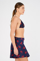 Profile view of model wearing the Oroton Dutch Tulip Skort in North Sea and 100% cotton for Women